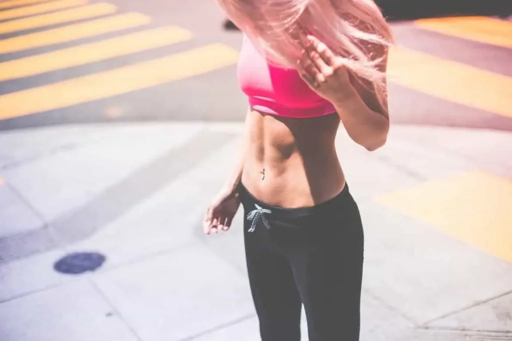 Woman with toned stomach after LA-EMS Body Sculpting Treatment Chester