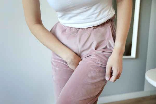 woman running for the toilet because of urinary incontinence Chester